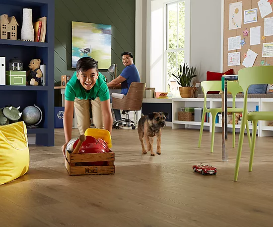 Happy kid playing with puppy | Carpet Advantage